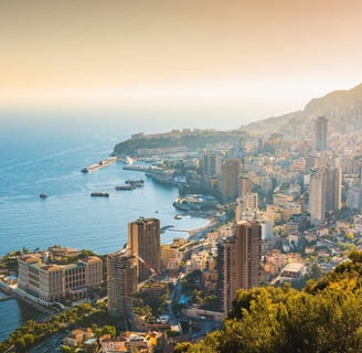 a cityscape of Monaco and the sea