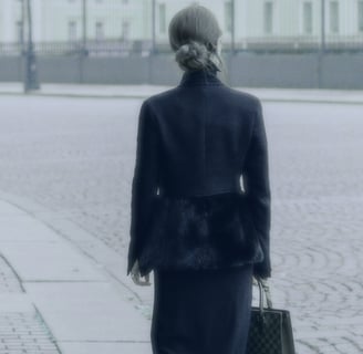 Professional woman walking down street 