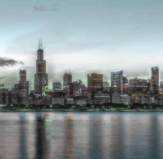 City skyline at dusk, reflected in water — symbolizing clarity, scale, and transition