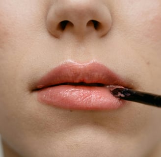 a woman applying lipstick