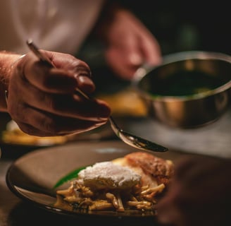 a person is presenting food on a plate