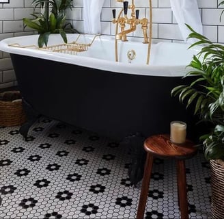 penny mosaic tiles under the tub in bathroom