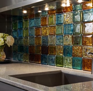 this image displays a kitchen back splash with multi color recycled glass tiles.