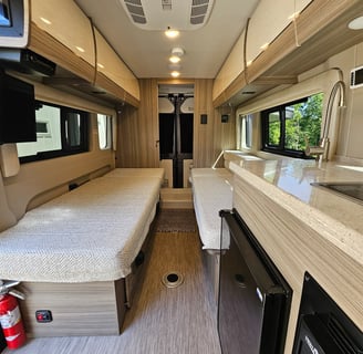 Sleeping area of barely used 2023 Entegra Coach Ethos 20T Class B RV for sale.