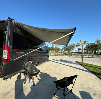 Awning of barely used 2023 Entegra Coach Ethos 20T Class B RV for sale.