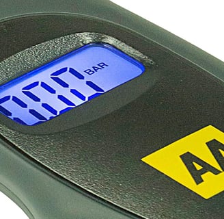 AA Digital Tyre Pressure Gauge AA1634 in use, checking tyre pressure with its backlit LCD screen and ergonomic handle