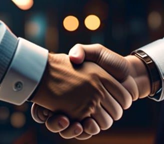 two people shaking hands with a man in a suit