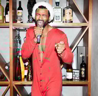 a man in a red suit and ballber pro body trimmer for men