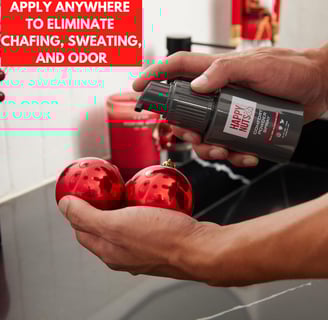 a person holding comfort spray deodorant for men from happy nuts