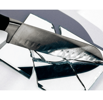 knife held over a broken mirror