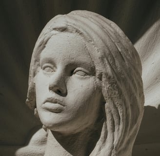 An image of a statue with blank eyes and an expressionless face