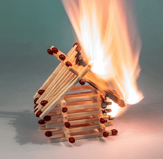 A house of matches burning down, a symbol of being triggered