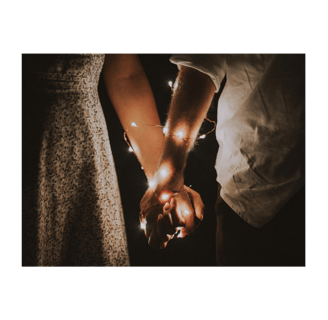 Held hands with fairy lights wrapped around them both, a healthy relationship
