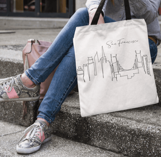 a woman sitting on steps with a bag