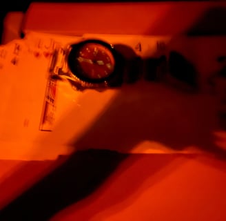 a person holding a clock and a clock on a table
