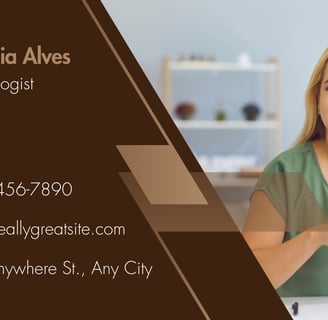 a woman sitting at a table with a business card