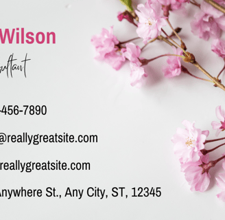 a business card with a pink flower on it