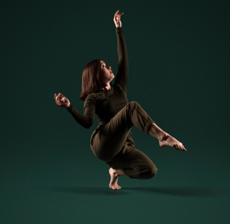 WCDC dancer balancing on one foot.
