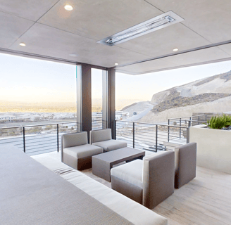 a patio with a couch and a table