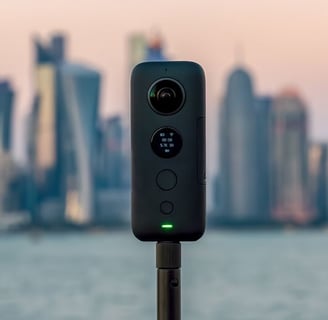 a camera with a city in the background
