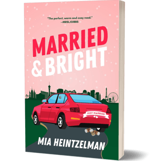 A car with "Just Married" on the back and Las Vegas city line in the background
