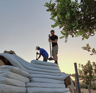 building with superadobe in portugal