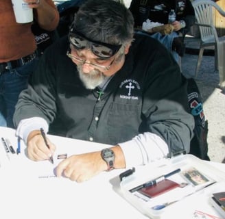 Caricature artist drawing biker cartoons.