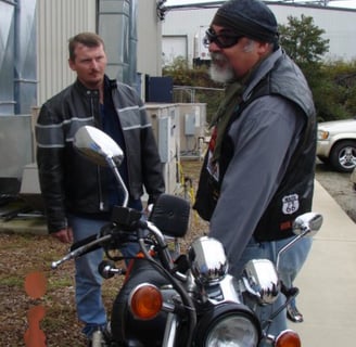 Being on the road on two wheels, drawing caricatures, is fun. But it can get real too.