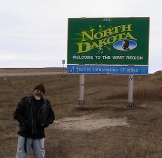 Rom (aka OpaDopa) stands at the border of North Dakota on a cold, autumn afternoon.