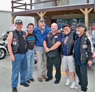The crew at a motorcycle rally, sharing the Gospel and drawing biker caricatures.
