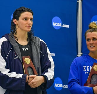 a woman holding a trophy and a trophy