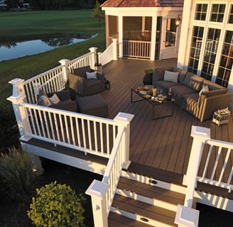 a deck with a couch and chairs and a table