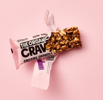 a Granola bar in a pink rapping