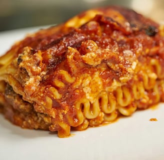 a piece of pasta with pasta and cheese sauce