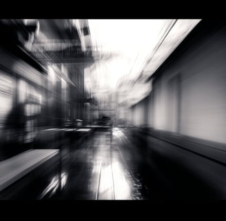 a blurry photo of a clock tower in a city