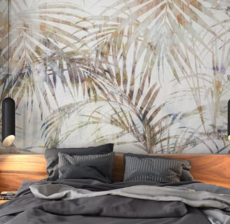 a bed with a large painting on the wall