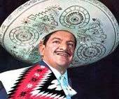 a man in a mexican - style hat with a large hat on his head