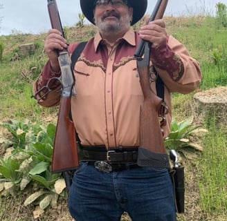 a man in a cowboy hat and a cowboy hat