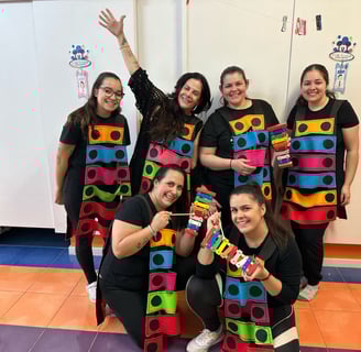 a group of people in colorful costumes posing for a picture