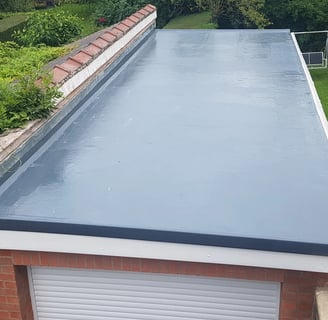 a new flat roof installed using liquid roofing showing professional roofing