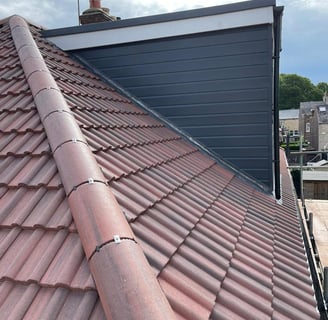 a new roof with a skylight and a skylight on top of a roof and dry ridge system London 