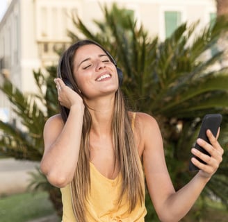 a girl happy listening music from a phone