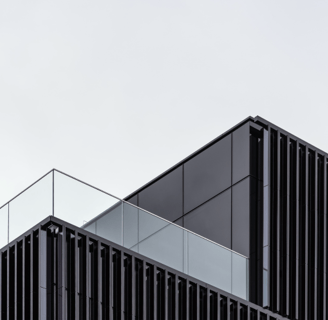 a building with a clock towering over a balcony-3D RENDERING SERVICES