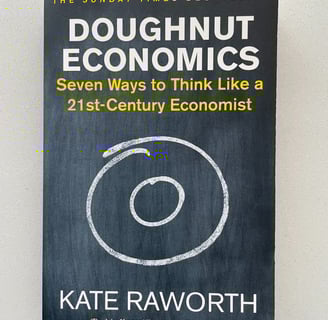 a book cover of Doughnut economics