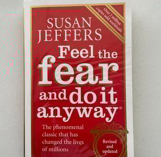a book cover of a book with a red cover Feel the fear and do it anyway