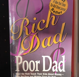 a book cover of rich dad poor dad