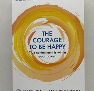 a book cover of the book the courage to be happy