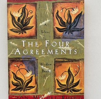 a book cover of the four agreements 