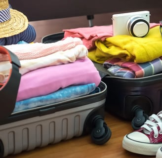 a suitcase with a hat and a hat on it