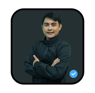 a man in a black jacket and a blue button